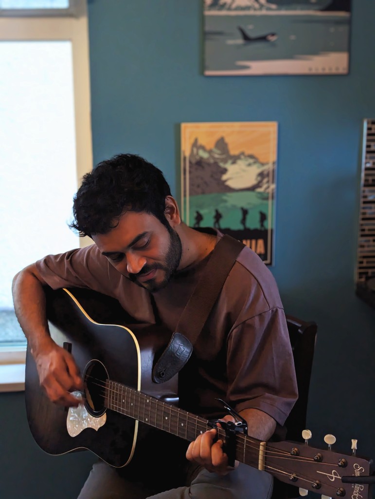 Nachiket Dabhade playing guitar